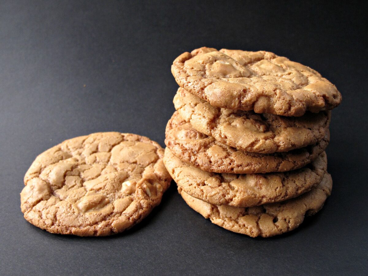 Stack of cookies on black background.