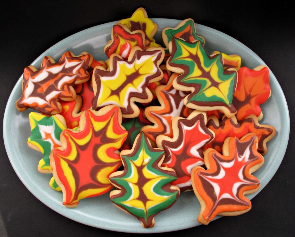 Decorated Thanksgiving Sugar Cookies,iced like fall leaves on a platter.