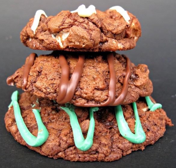 Stack of three cookies on a black background.