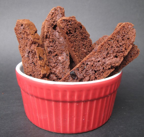 Chocolate Espresso Biscotti standing in a red bowl.