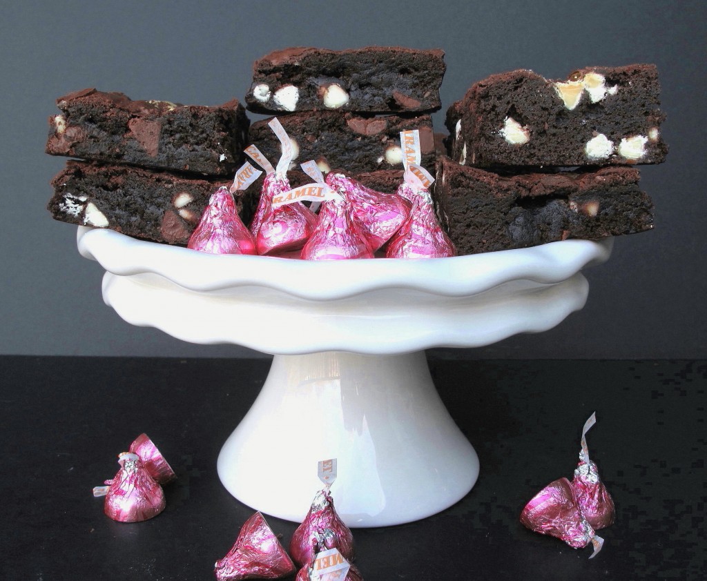 Hugs and Kisses Brownies on a white cake stand.