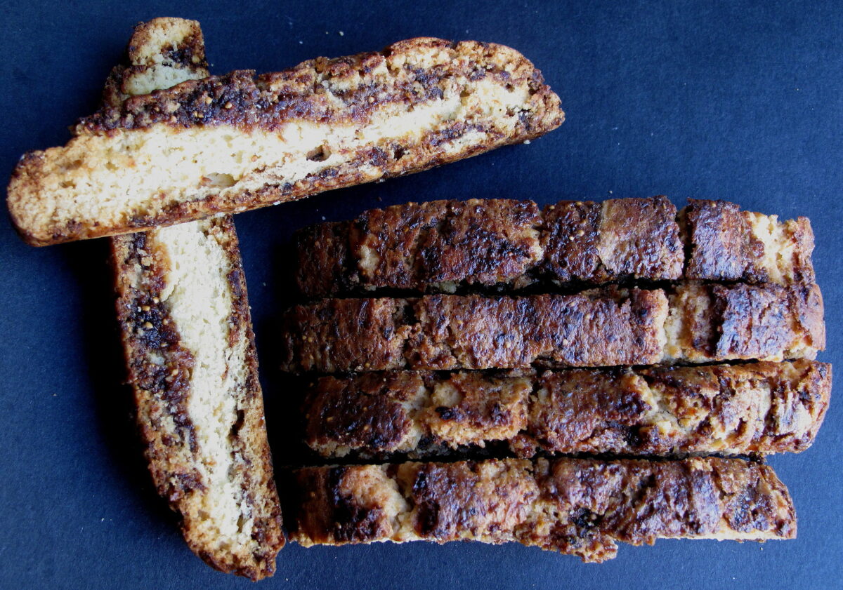 Overhead image showing browned biscotti tops and fig jam inside.
