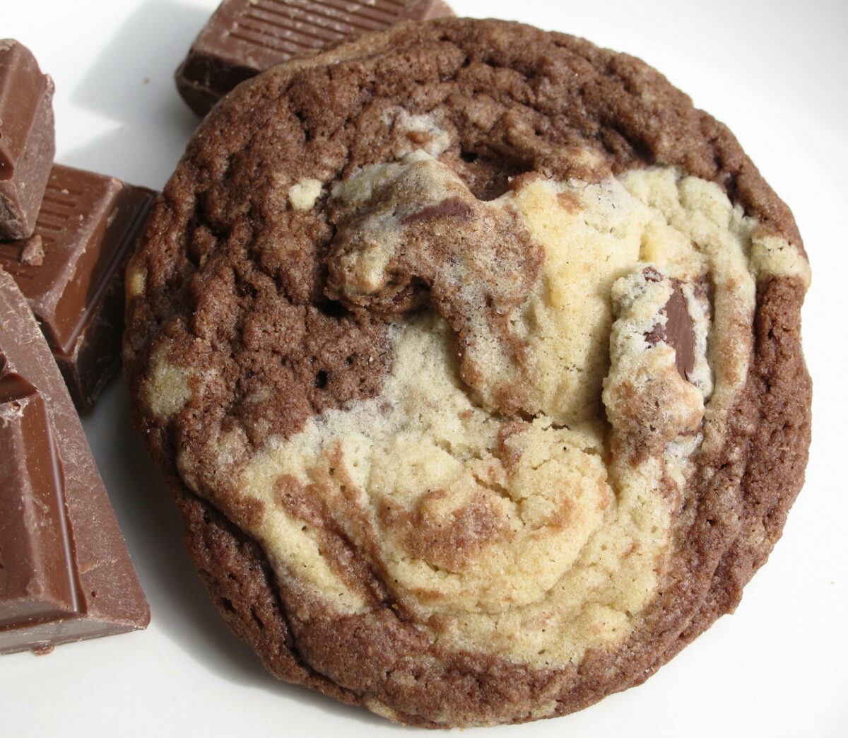 Closeup of a Marbled Chocolate Chunk Cookie swirled with chocolate and vanilla dough.