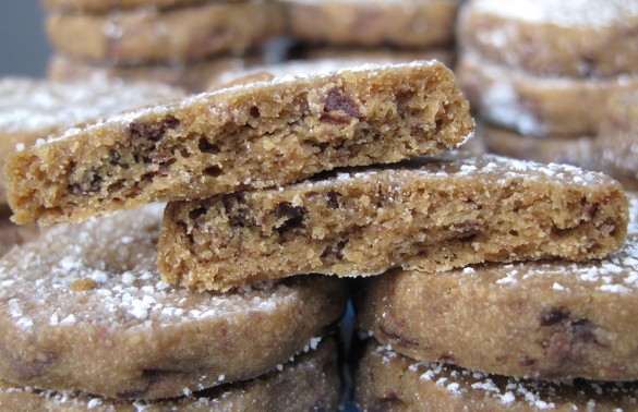 A cookie cut in half to show in inside of Espresso Chocolate Shortbread Cookies.