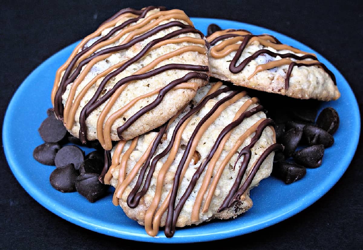 Cookies with chocolate and butterscotch zigzags on a plate.