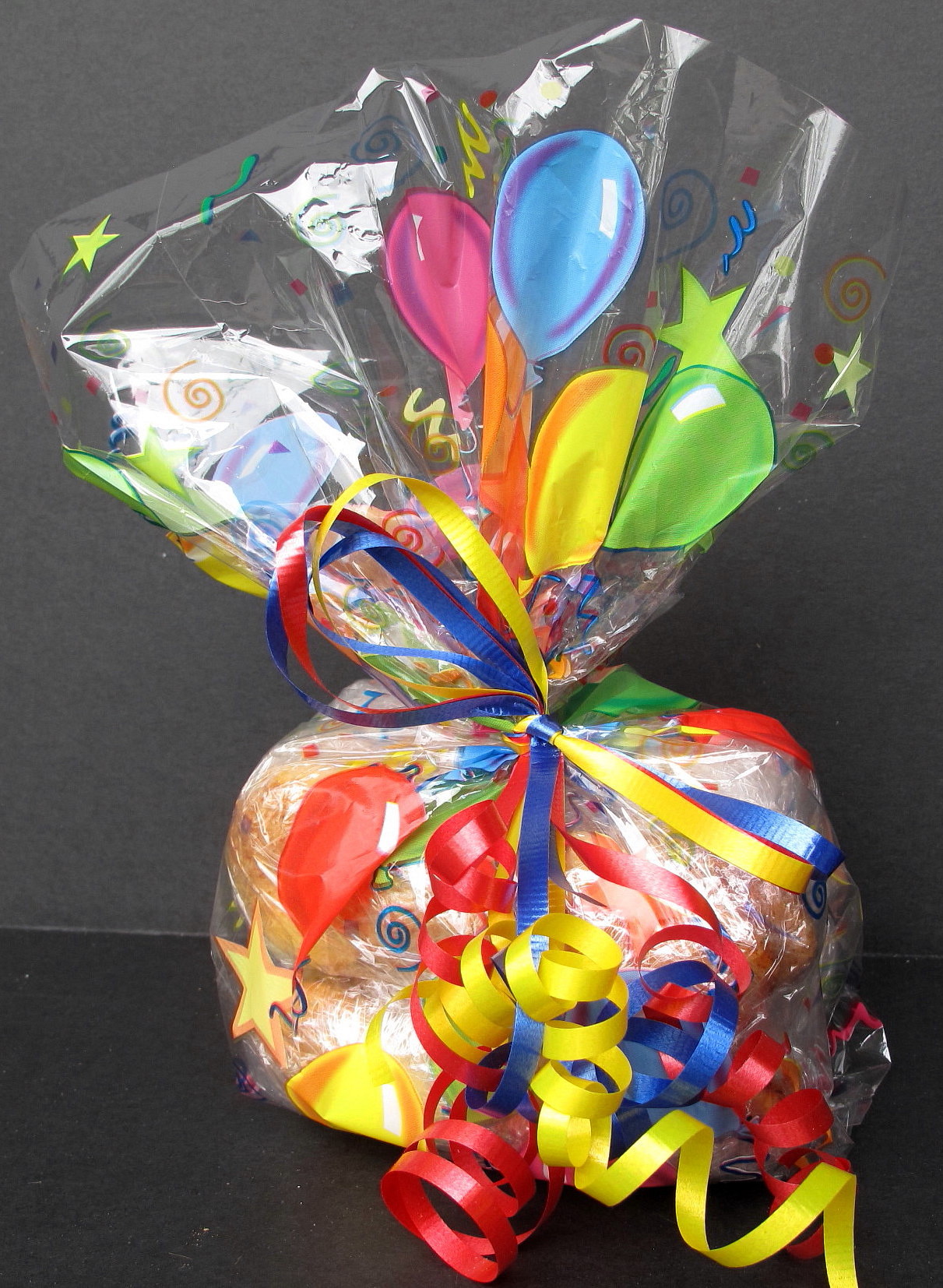 cookies in a cellophane bag tied with curling ribbon for gifting