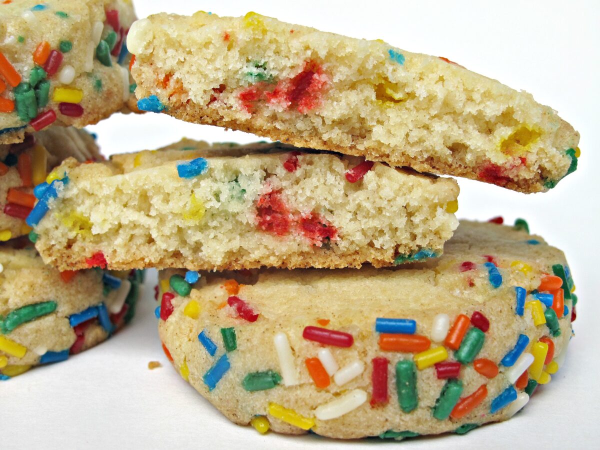 Closeup of inside of a slice and bake cookie with funfetti sprinkles inside and on the sides.