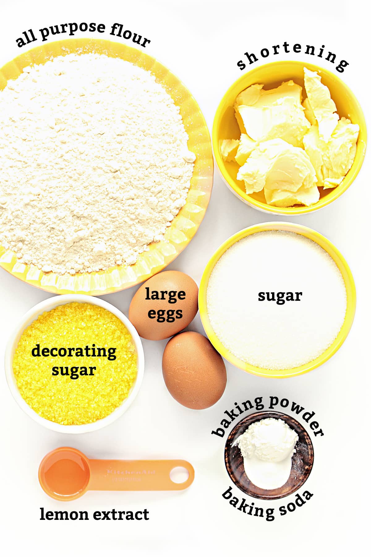Ingredients labeled: flour, shortening, sugar, eggs, baking powder, baking soda, lemon extract, decorating sugar.