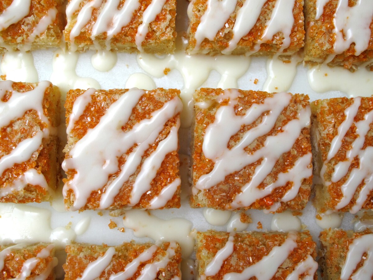 Overhead of bars lined up for drizzle of white icing.