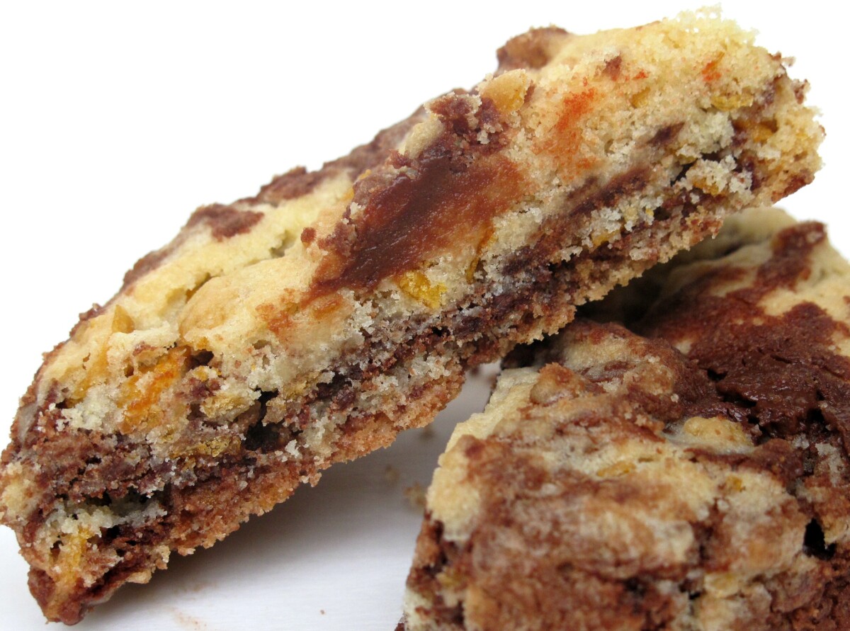 Chocolate-vanilla cookie cut in half showing interior crumb.