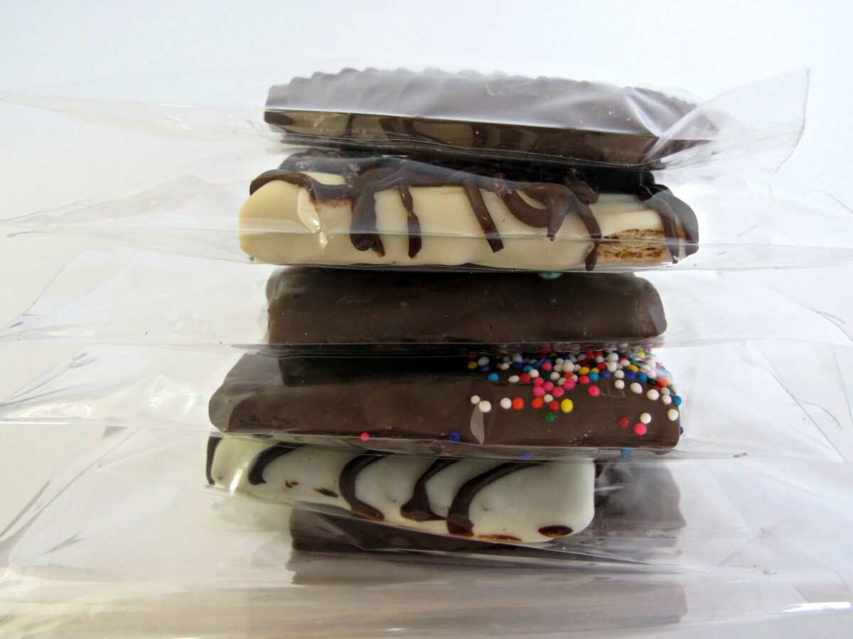 Stack of Chocolate Covered Graham Crackers each in a cellophane bag.