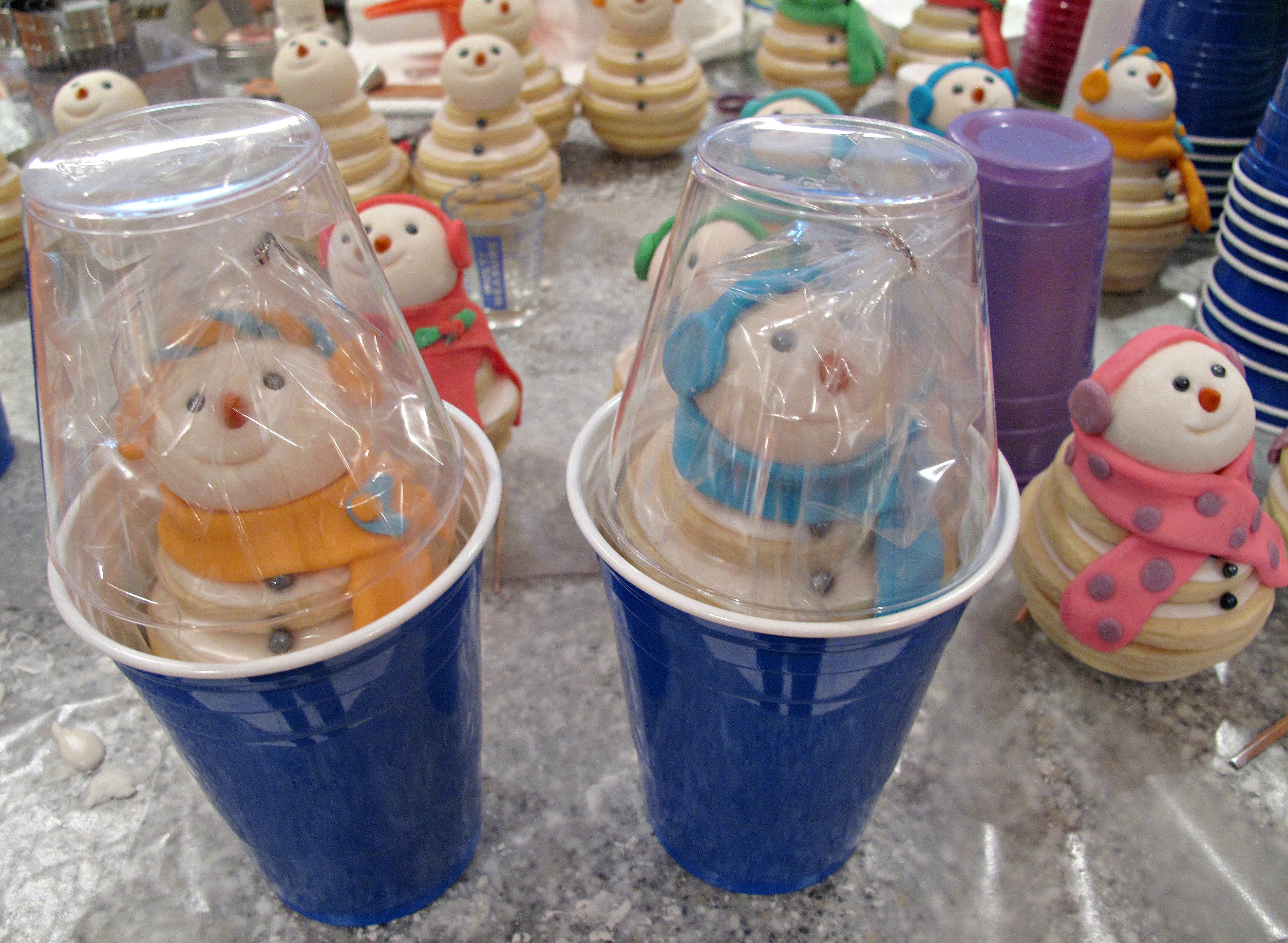  Snowmen Cookie Stacks packed in capsules made from two plastic drinking cups.