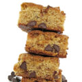 Stack of cookie bars with chocolae chips inside.