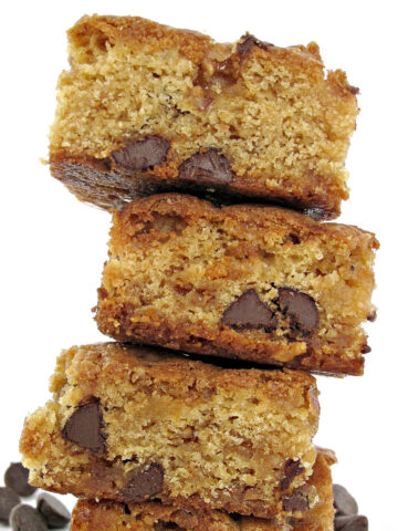 Stack of cookie bars with chocolae chips inside.