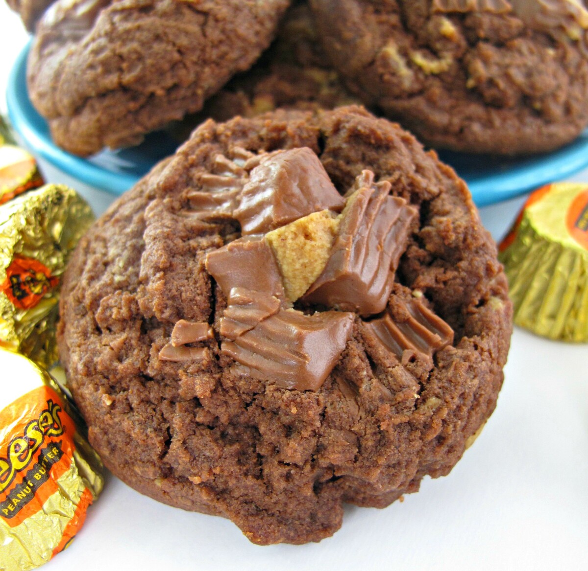 Closeup of a Chocolate Peanut Butter Cup Cookie with chopped peanut butter cup candy on top.