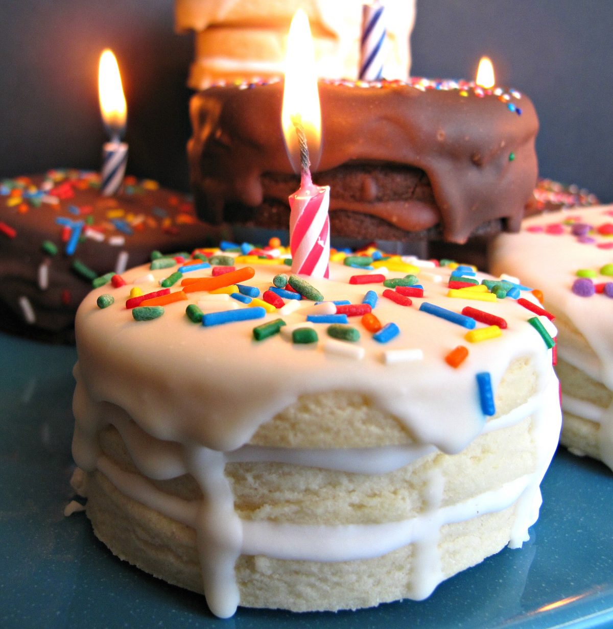 Closeup of  vanilla Birthday Cake Surprise Cookie with lit candle on top.