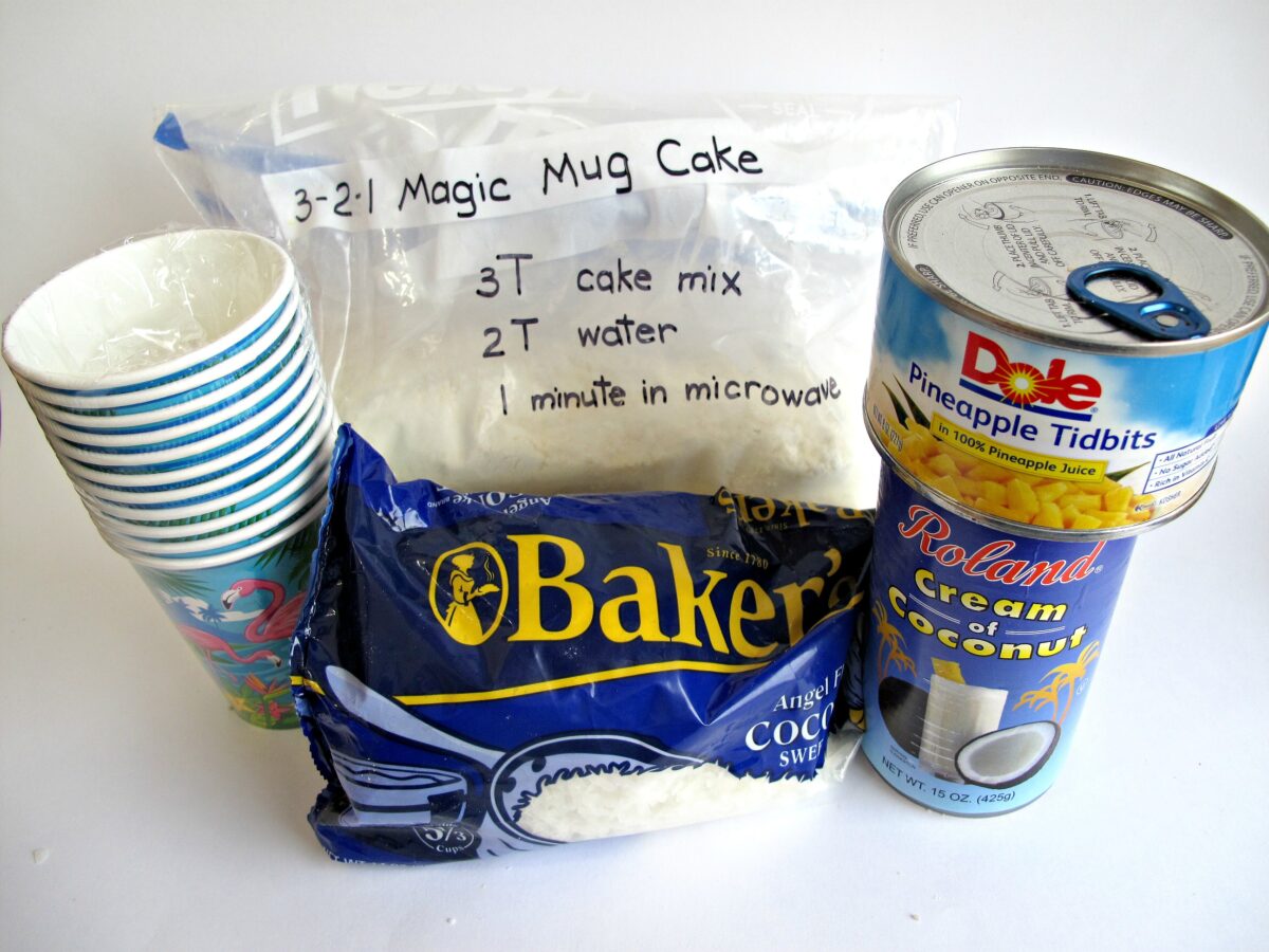 Ingredients: paper cups, mug cake mix, canned pineapple tidbits, cream of coconut, shredded coconut.