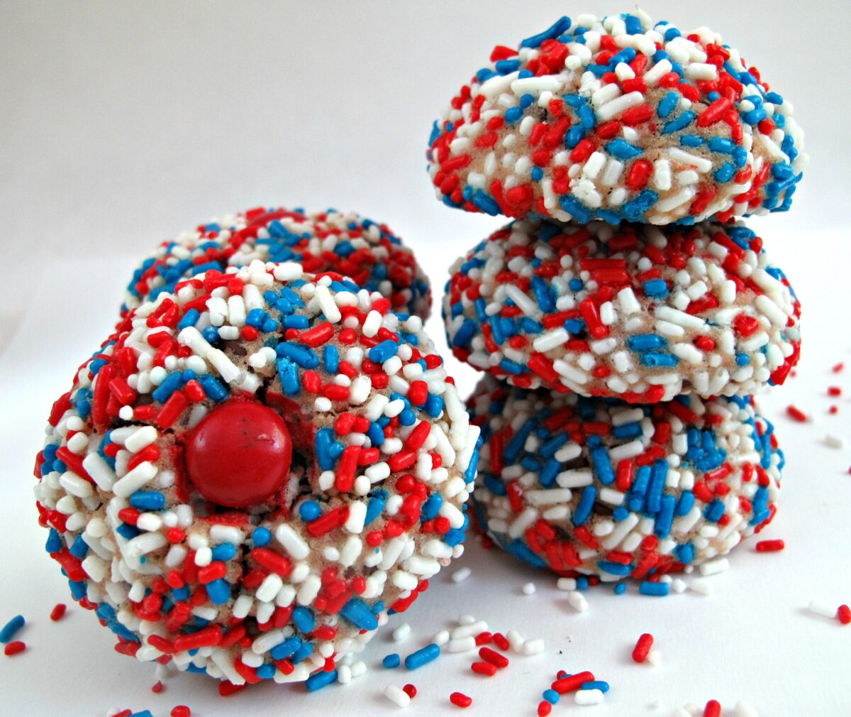 Cookies coated in red, white, blue patriotic jimmies sprinkles.