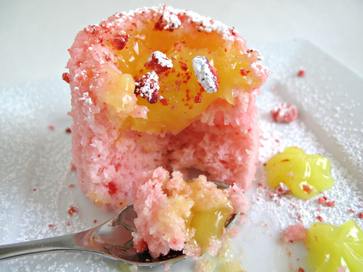 Strawberry Lemonade Mug Cake with a spoonful of cake and lemon curd.