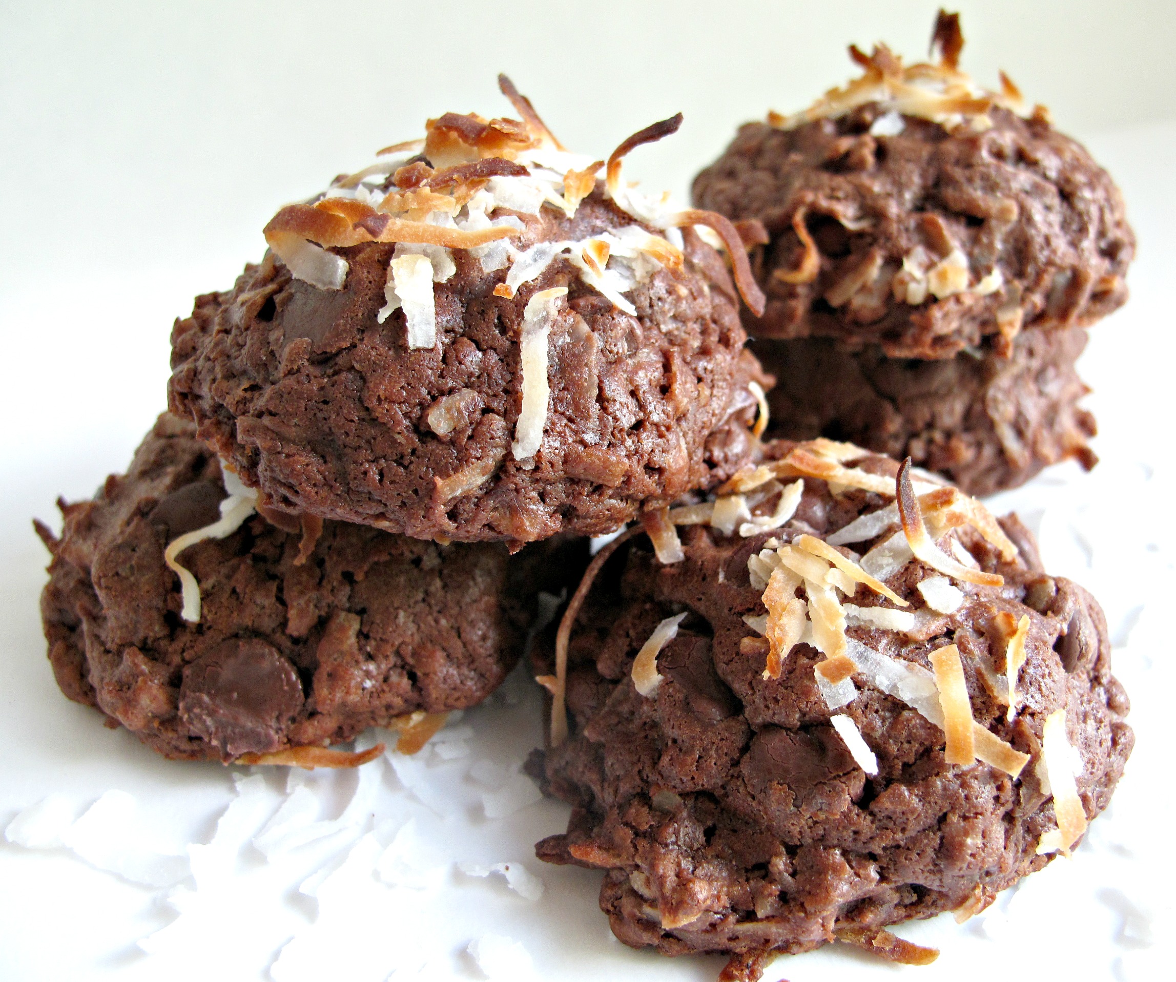 Chocolate Coconut Bliss Cookies topped with browned coconut.