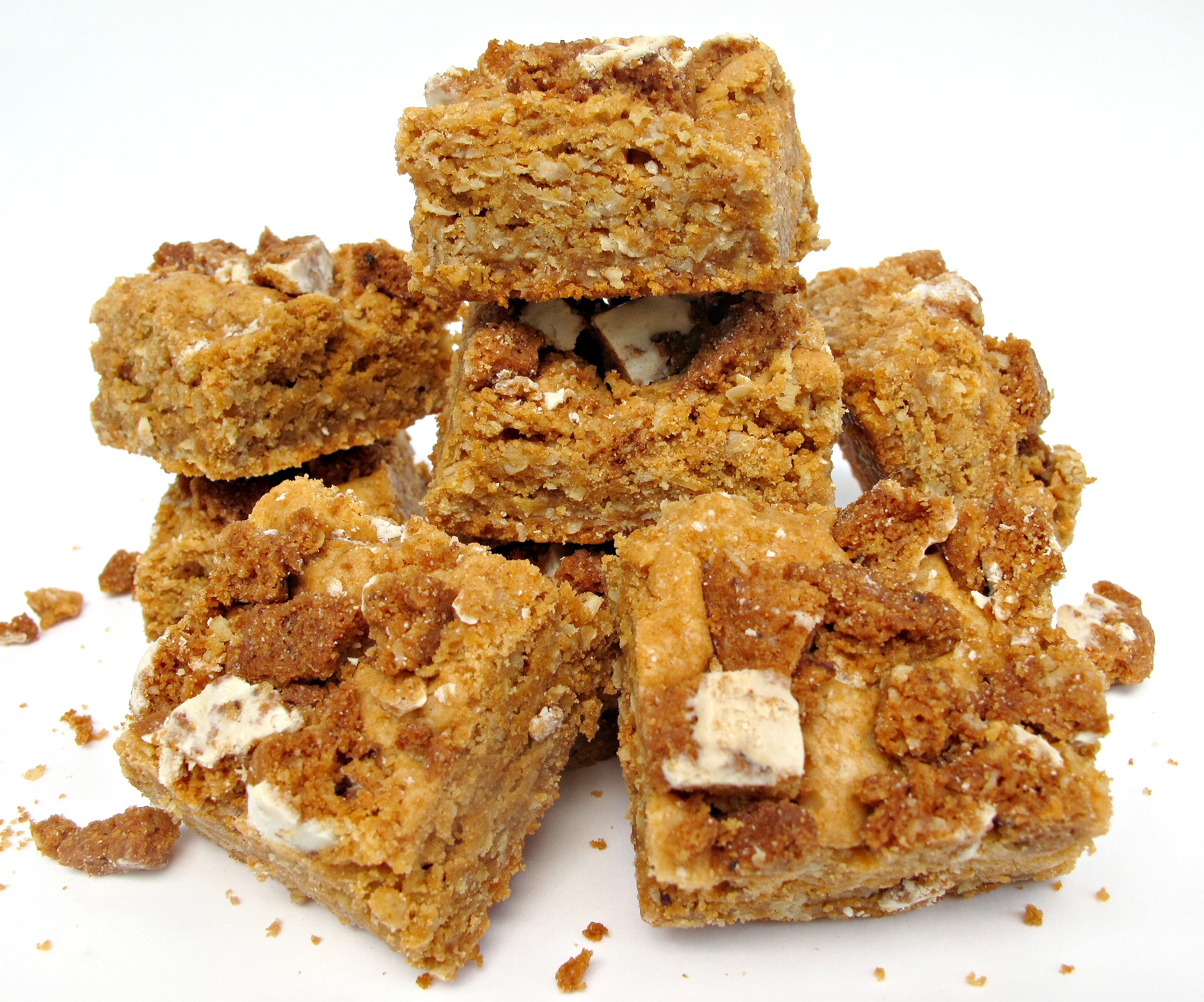 Butterscotch Oatmeal Bars topped with crumbled oatmeal cookies.