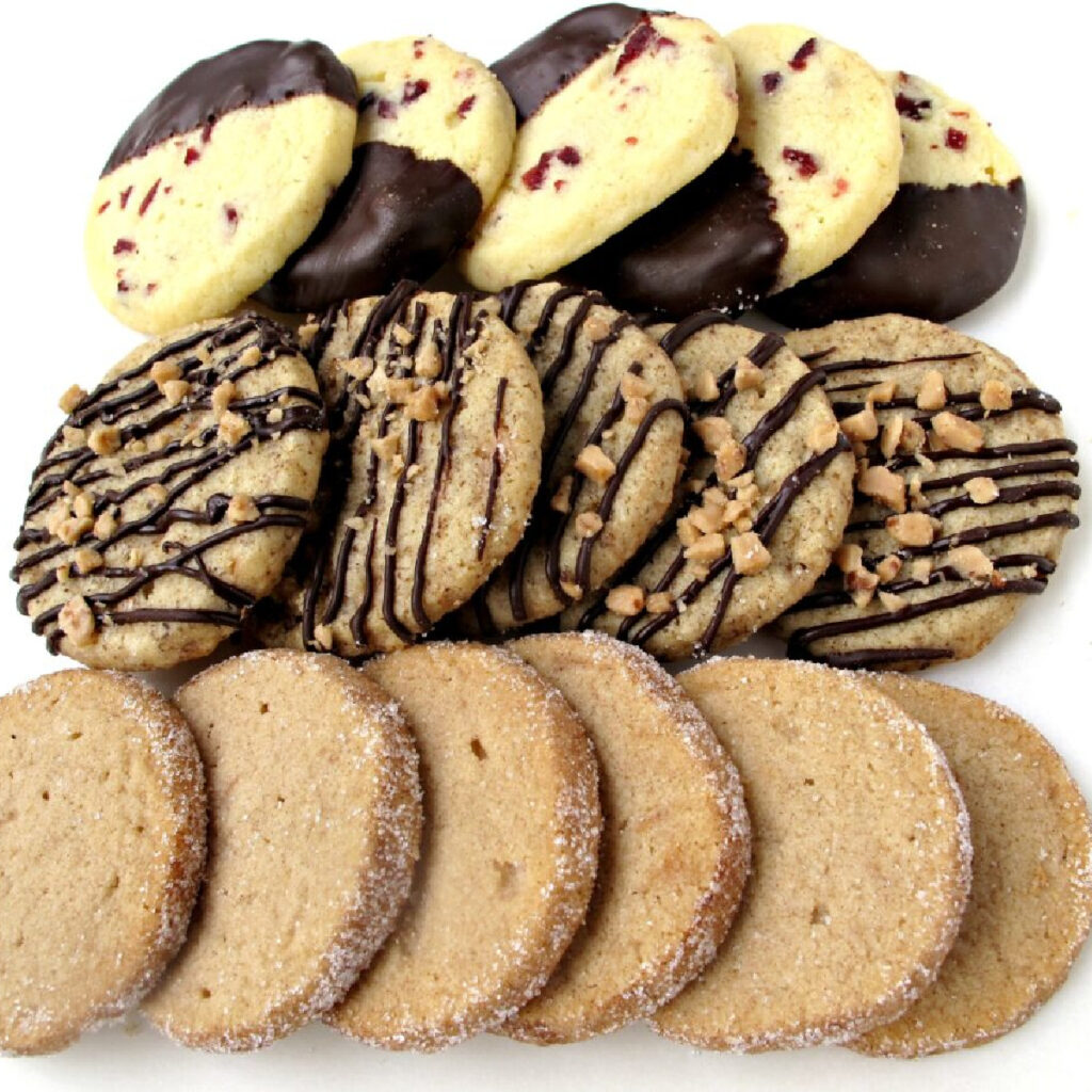 Three rows of different flavored shortbread cookies. including orange-cranberry, toffee-espresso, and cinnamon brown sugar.