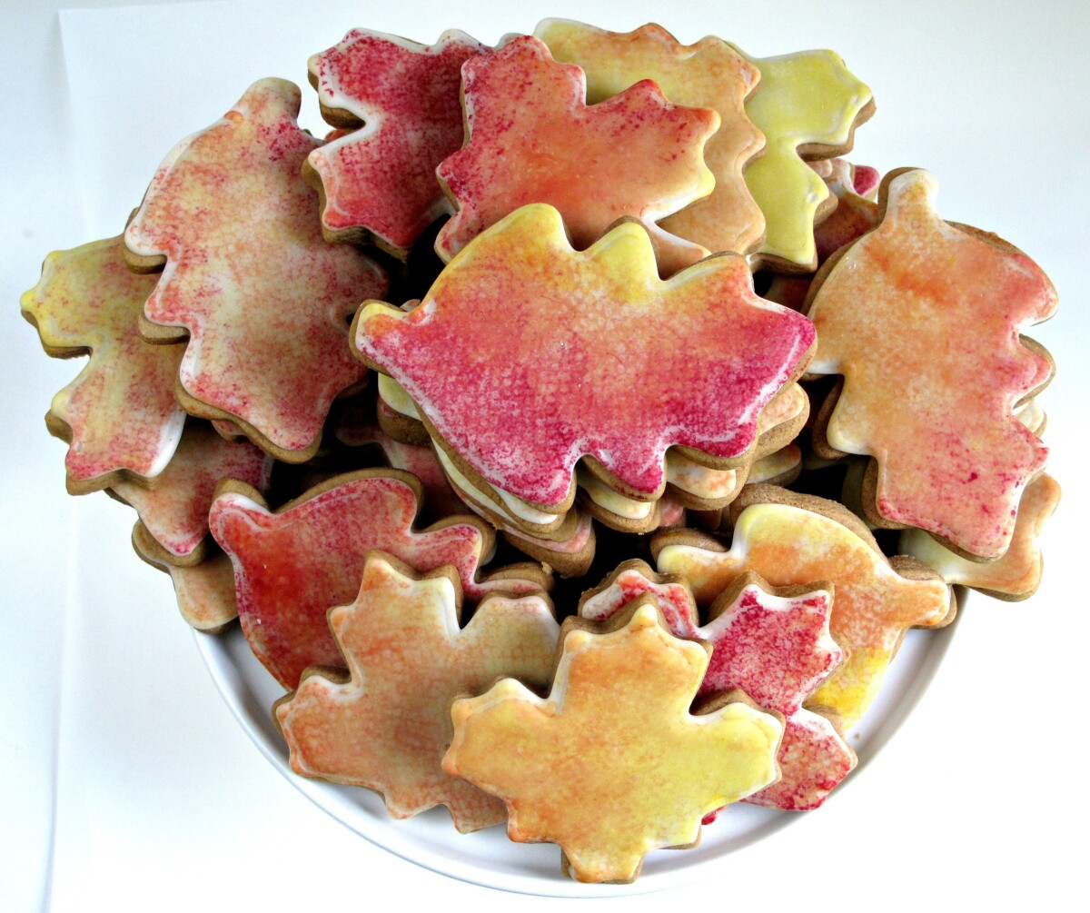 Gingerbread Fall Leaves Cookies on a white serving plate.