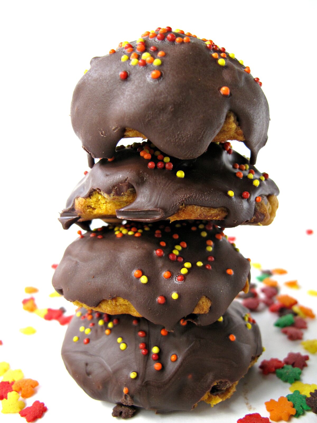 Stack of thick, round chocolate coated cookies.