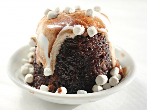 Hot Chocolate Mug Cake in a white bowl with melted marshmallow topping and sprinkled mini marshmallows