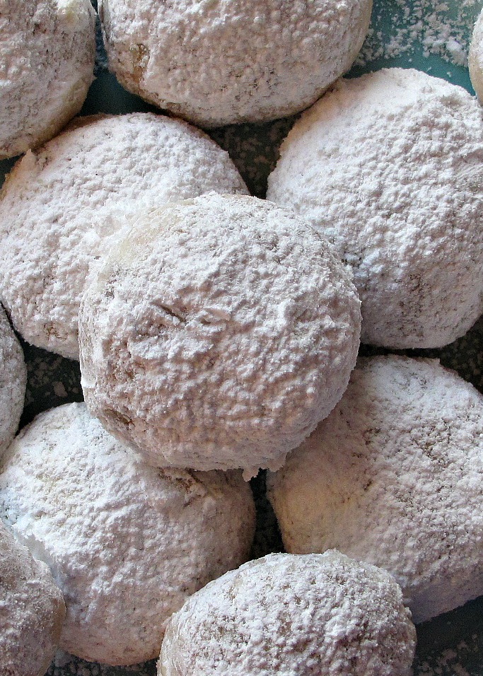 Closeup of powdered sugar on Cinnamon Snowball Cookies.