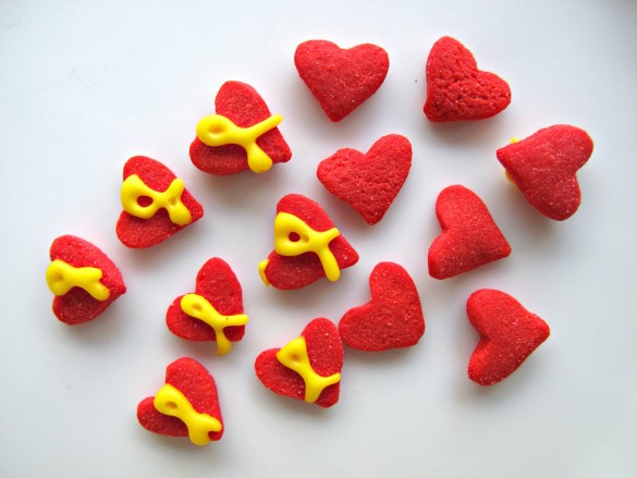 Red heart sprinkles each with a yellow "support our troops" ribbons piped on top.