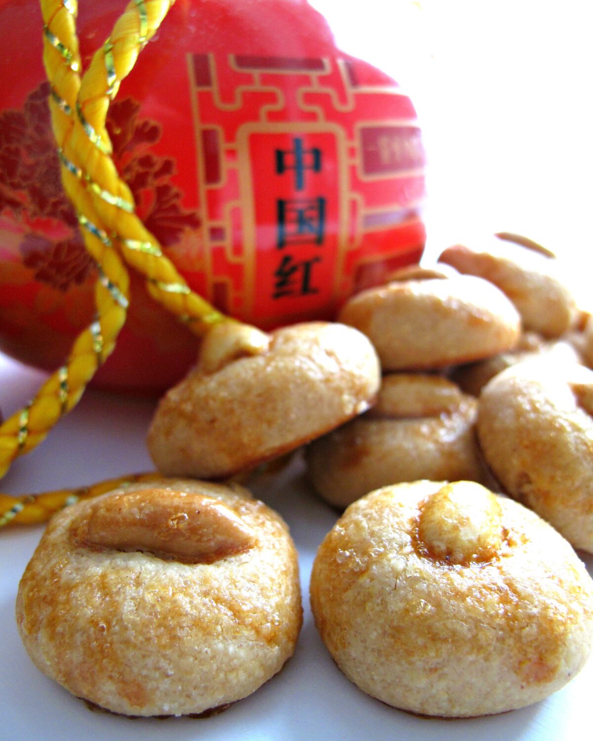 Closeup of Chinese New Year Peanut Cookies with a shiny egg wash glaze.