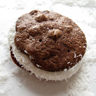 Passover Chocolate Coconut Whoopie Pies- ultra-chocolaty, chewy chocolate chip cookies sandwiched with marshmallow filling and dipped in shredded coconut. They happen to be kosher for Passover and gluten free. But no one would ever know. They are THAT good!| The Monday Box
