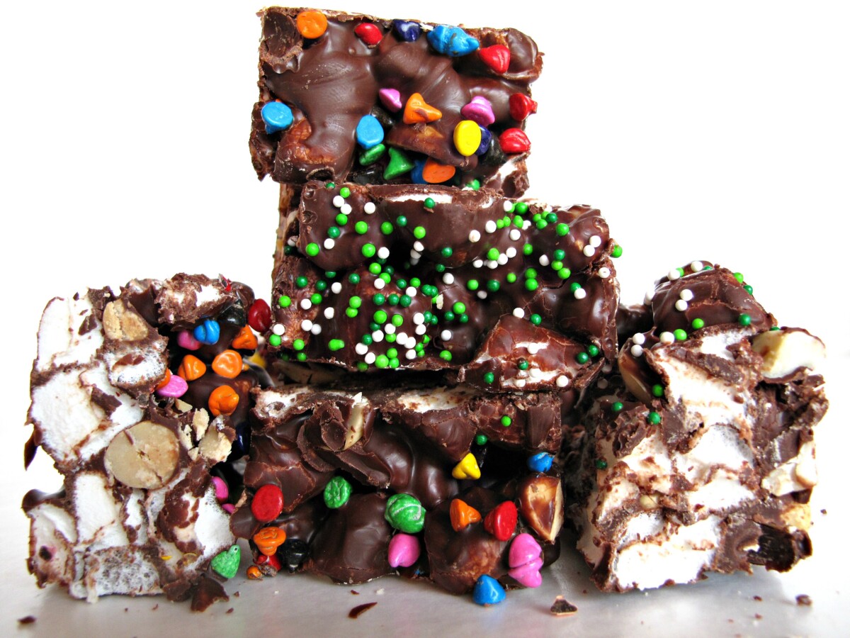 Rainbow's End Rocky Road Candy in a pile topped with green and white sprinkles and rainbow colored chips.