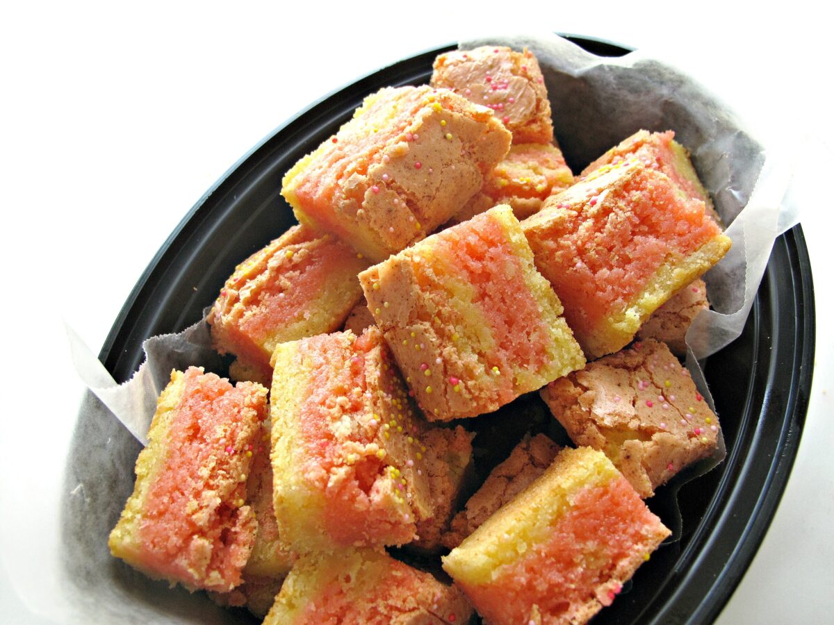 Strawberry Lemonade Bars with layers of pink and yellow blondie.