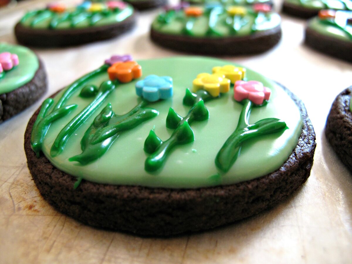 Closeup of  spring flowers cookie from the side showing icing thickness.
