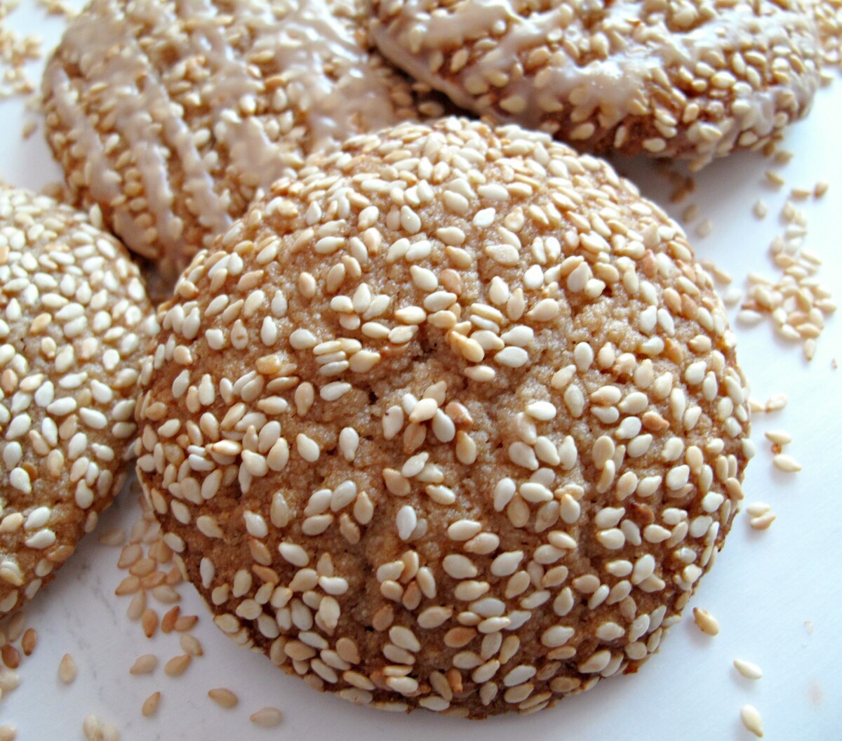 Closeup showing the sesame seed covered cookie.