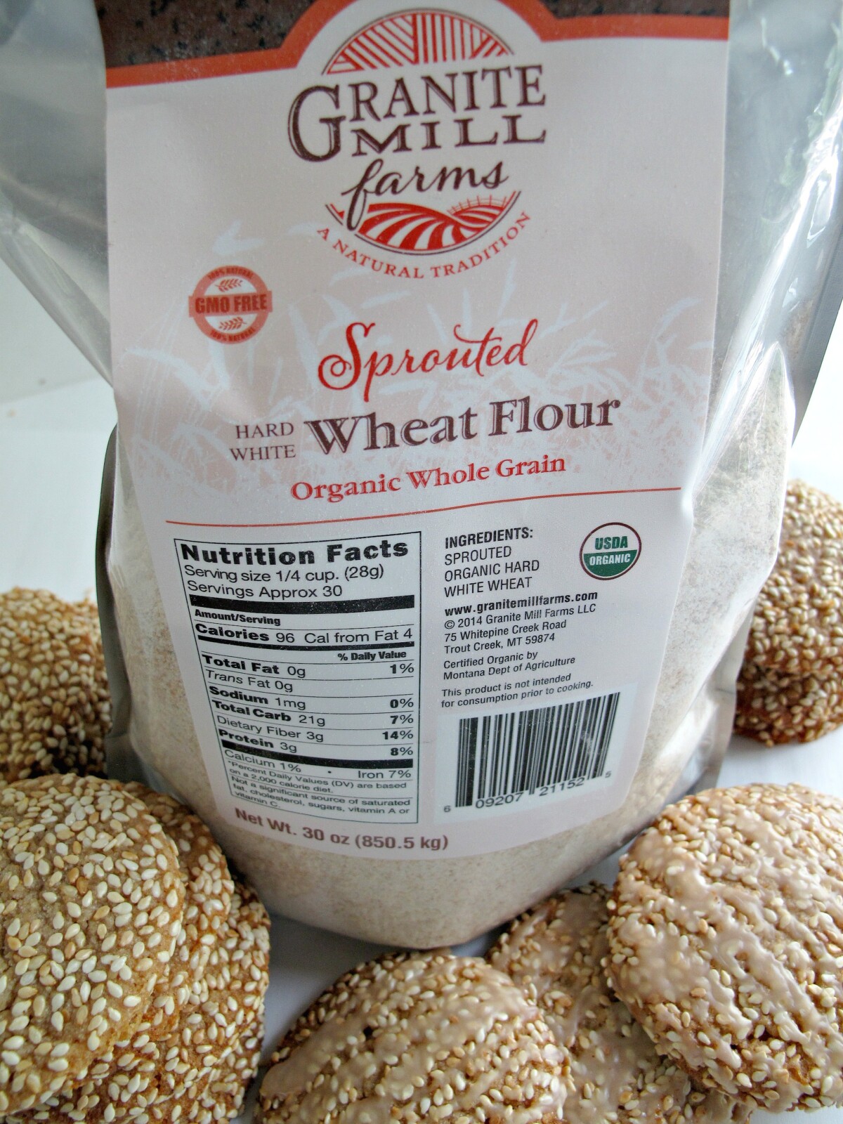 A bag of Granite Mill Farms wheat flour and some cookies.