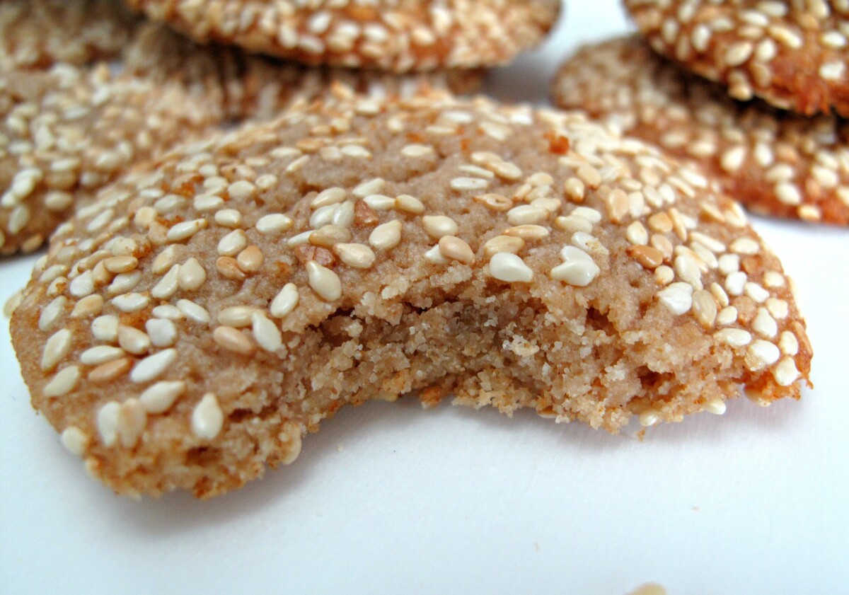 Closeup of a cookie with a bite taken showing the soft interior of the cookie.