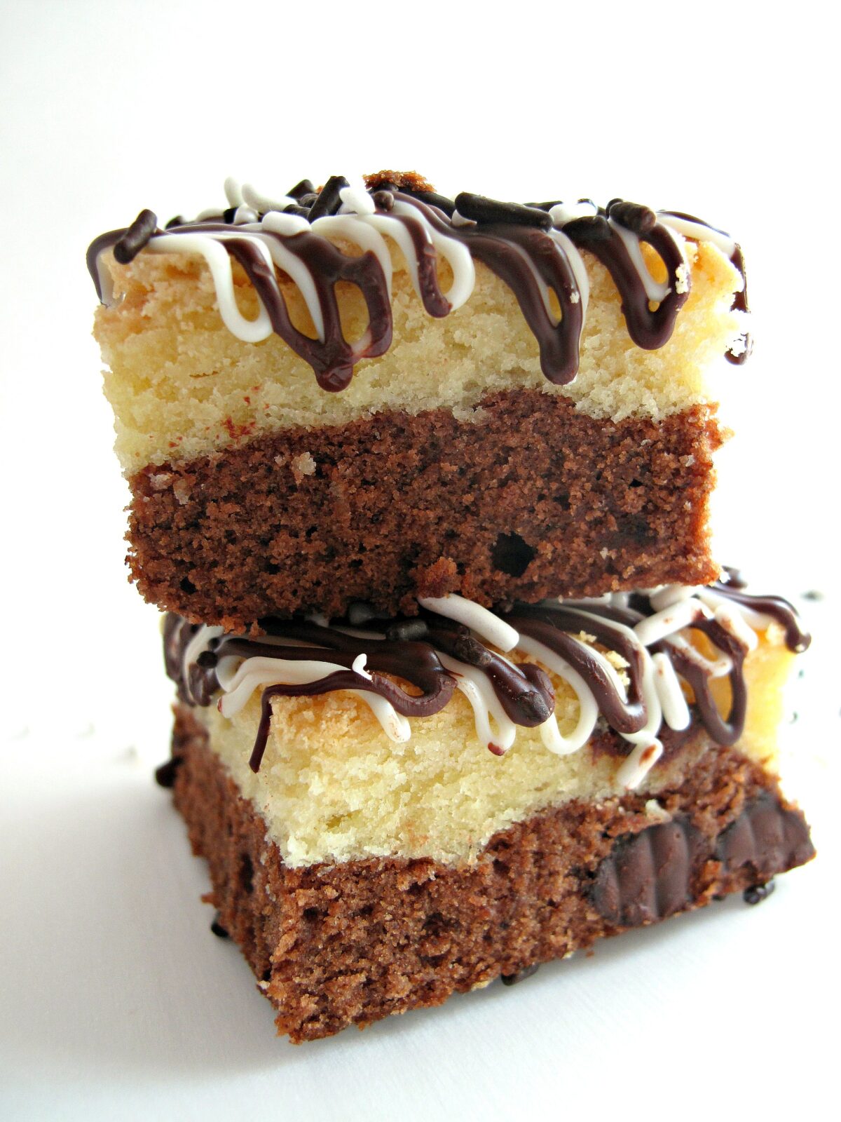 Stack of two bars from the side showing the layers of blondie top and brownie bottom.