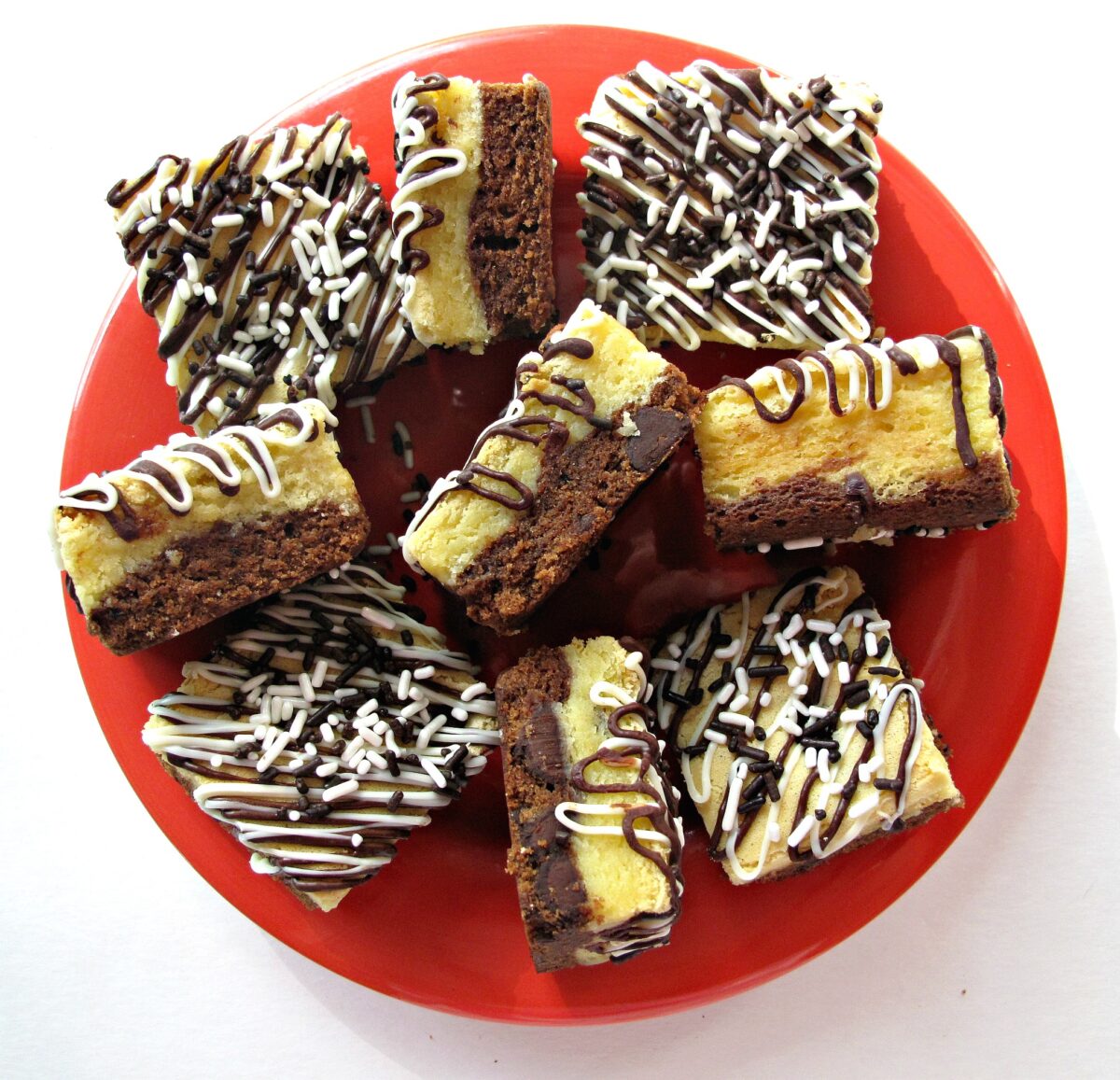 Serving platter of Black and White Bars, blondie layer topping  a brownie layer. 