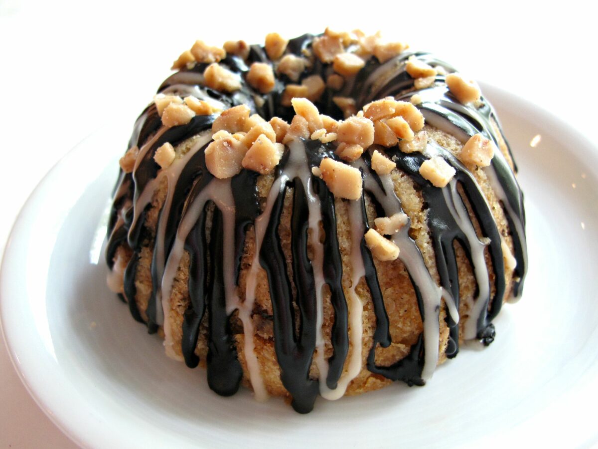 Closeup of the chocolate and vanilla stripes of drizzle on a mini bundt cake.