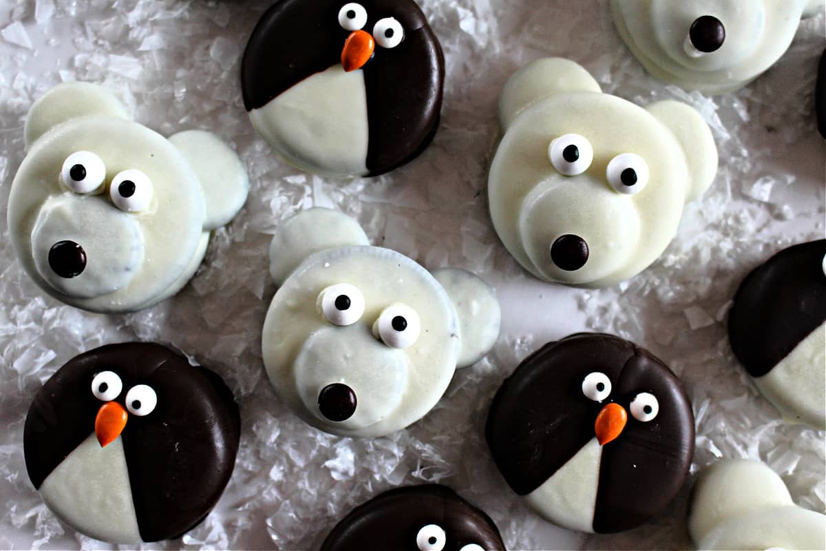Chocolate covered sandwich cookies decorated as polar bears and penguins.