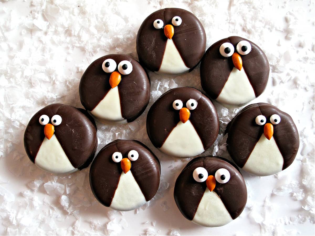 Penguin Oreos dipped in white and dark chocolate with candy eyes and beaks.