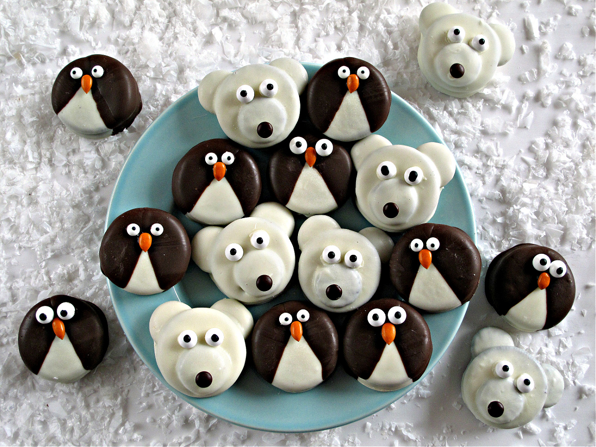 Penguin and Polar Bear Oreos on a blue plate.