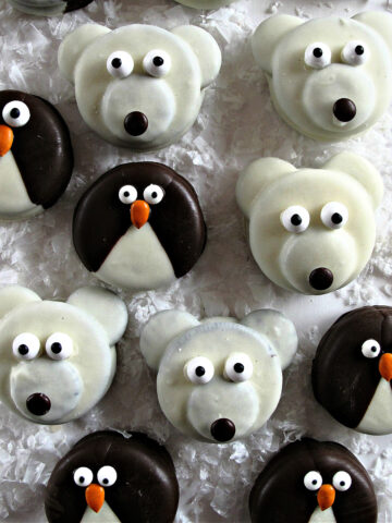 Chocolate covered Oreos decorated like polar bears and penguins.