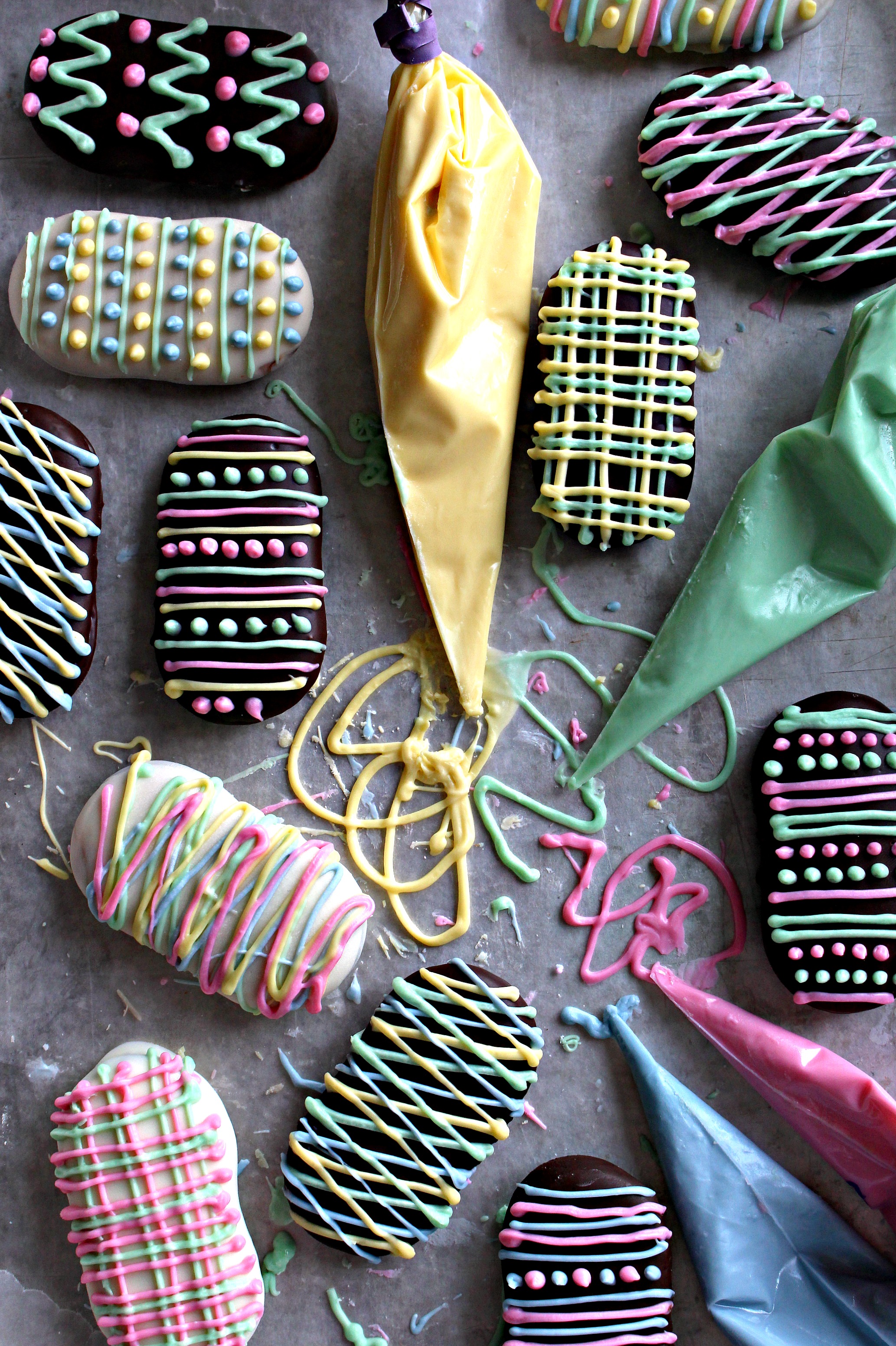 Milano Cookies coated in chocolate and decorated with colored chocolate to look like easter eggs.