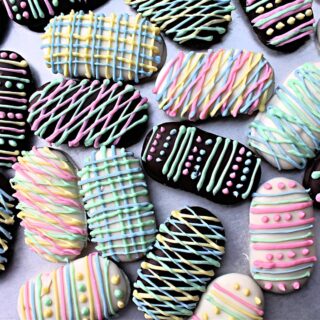 Chocolate covered Milano Cookies decorated like Easter Eggs.