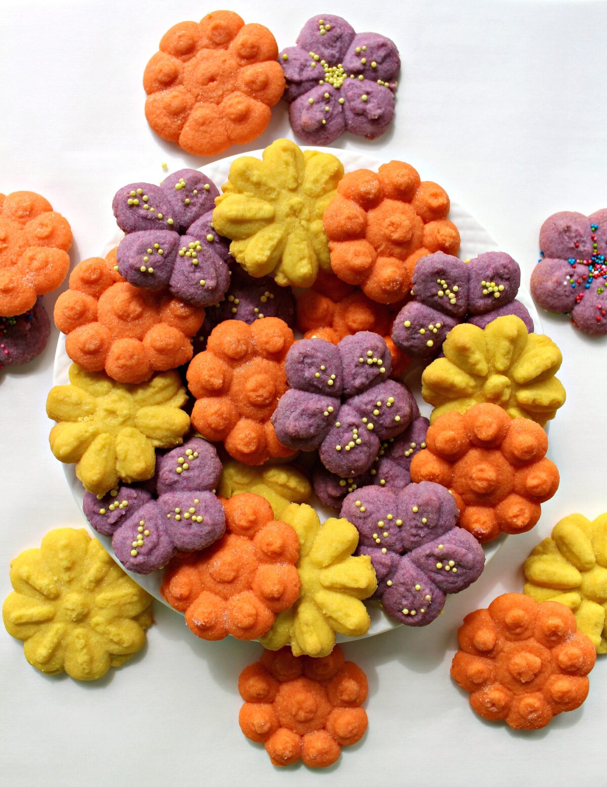 Flower shaped Cookie Press Butter Cookies in bright colors.