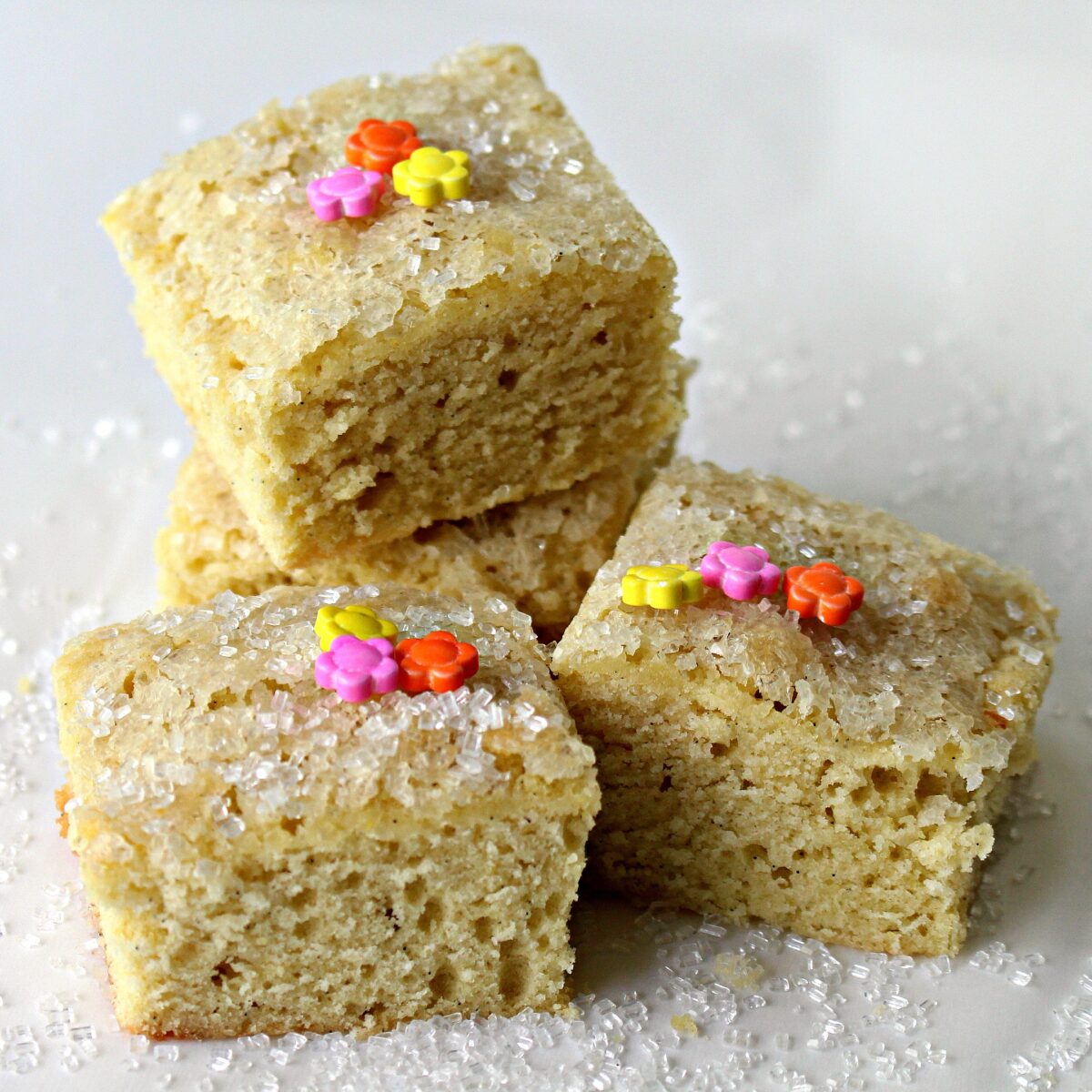 Stacked squares of sugar cookie bars.